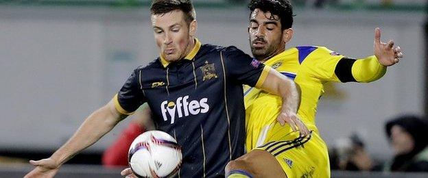 Dundalk midfielder Patrick McEleney shields the ball from Maccabi's Omri Ben Harush