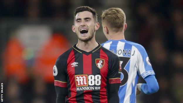 Bournemouth midfielder Lewis Cook shouts during a Premier League match against Huddersfield