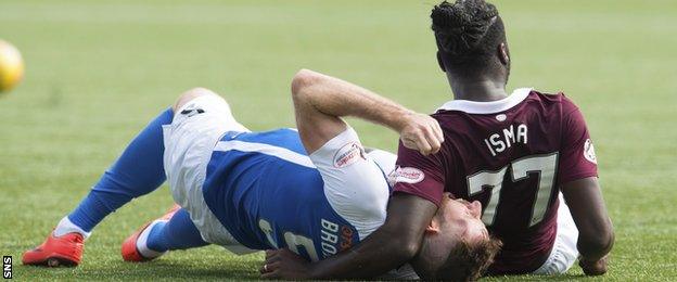 Kilmarnock's Kirk Broadfoot tangles with Hearts striker Isma Goncalves