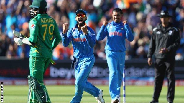 Virat Kohli (2L) of India celebrates as Ravindra Jadeja captures the wicket of Azhar Ali of Pakistan during the ICC Champions Trophy match between India and Pakistan at Edgbaston on June 4, 2017.