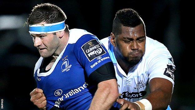 Leinster's Fergus McFadden is tackled by Taqele Naiyaravoro of Glasgow