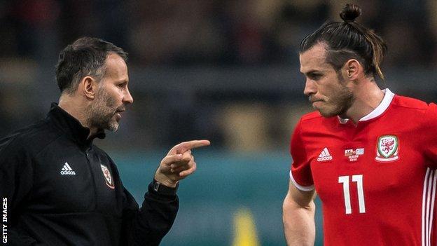 Ryan Giggs (left) gives instructions to Gareth Bale