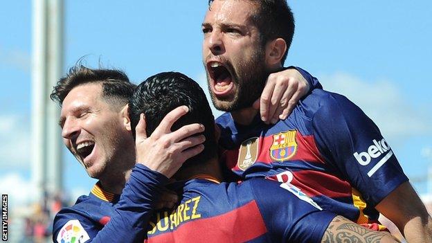 Barcelona players celebrate a Luis Suarez goal against Granada