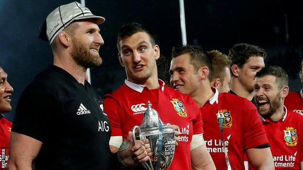 Kieran Read and half a dozen Lions pictured during the trophy presentation