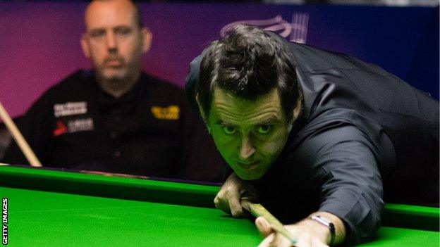 Mark Williams (background) is a three-time World Champion while Ronnie O'Sullivan has won it five times