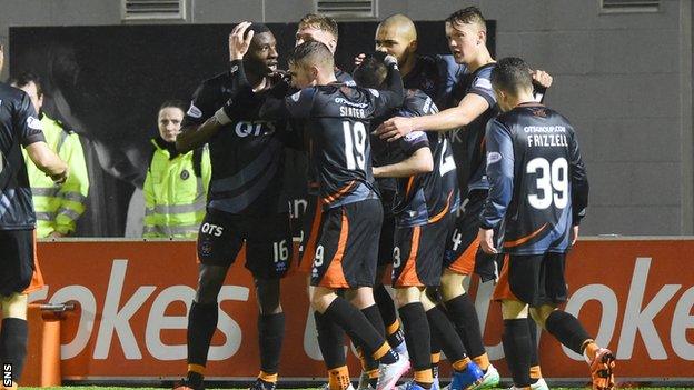 Obadeyi (left) is mobbed by his teammates after scoring Killie's winner