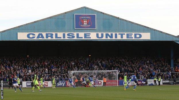 Carlisle United fans celebrate a goal in the team's match against Exeter in 2017