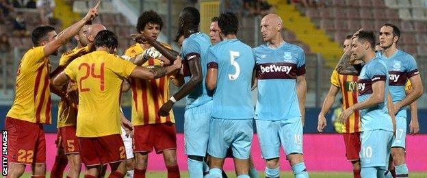 Birkirkara and West Ham players tussle during the match