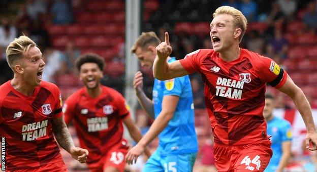 Josh Wright (right) celebrates scoring the goal which gave Orient an opening-day win over Cheltenham