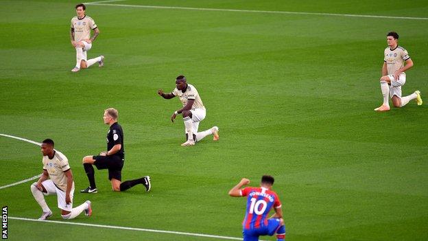 Premier League players take a knee