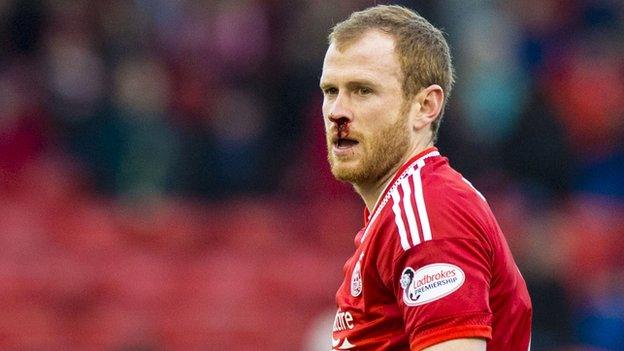 Aberdeen captain Mark Reynolds with a bleeding nose