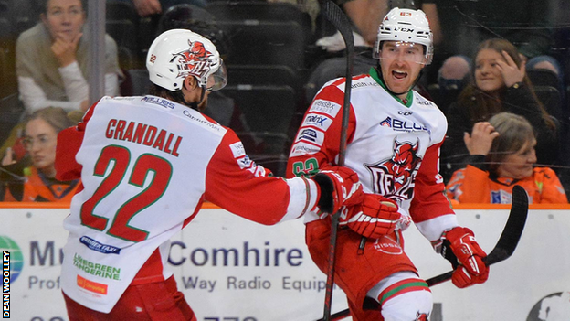 Trevor Cox and Justin Crandall celebrate