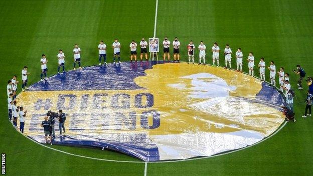 Players stood around a large Maradona flag before kick-off for a minute's applause