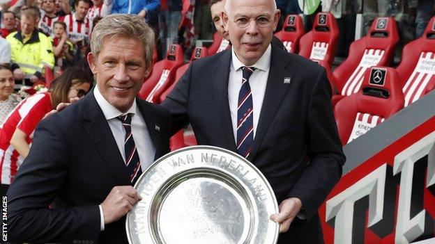 Marcel Brands (left) with the Dutch title trophy