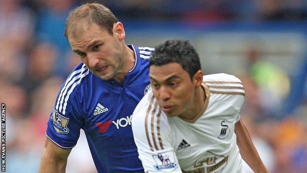 Chelsea defender Branislav Ivanovic (left) chases Swansea's Jefferson Montero