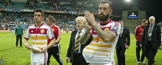 Scotland's Steven Fletcher steals the match ball after his hat-trick against Gibraltar