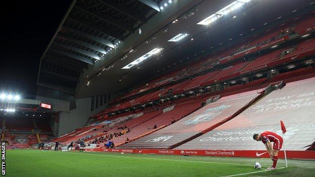 Liverpool's James Milner prepares to take a corner