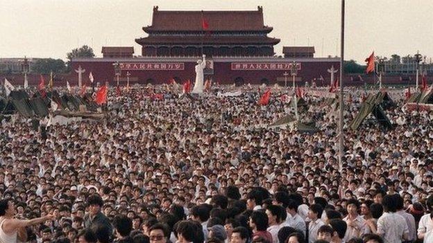 This file photo taken on 2 June 1989 shows hundreds of thousands of Chinese gathering around a 10-metre replica of the Statue of Liberty (C), called the Goddess of Democracy, in Tiananmen Square demanding democracy despite martial law in Beijing