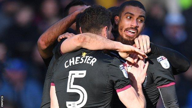 Aston Villa celebrate a goal by Lewis Grabban (right)