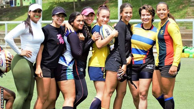 Isabel Romero and her team-mates pose for a photo