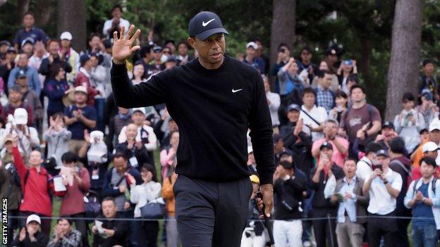 Tiger Woods acknowledges the crowd after a successful put at the Zozo Championship in Japan