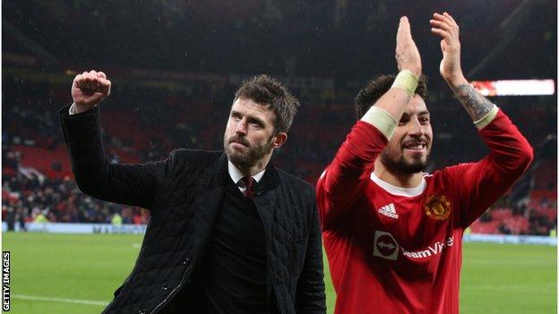 Michael Carrick (left) reacts after Manchester United's win over Arsenal in the Premier League