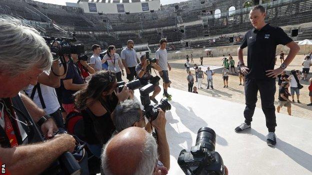 Chris Froome and photographers from the media