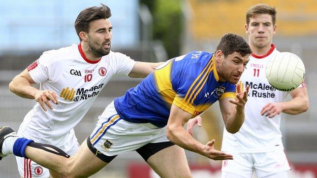 Tyrone's Tiernan McCann tackles Tipperary's Seamus Kennedy