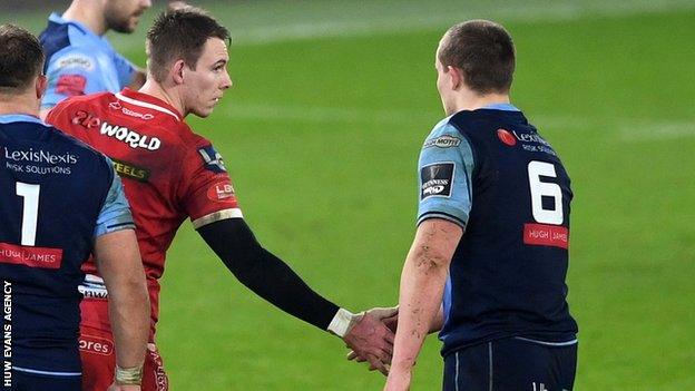 Liam Williams and Shane Lewis-Hughes shake hands