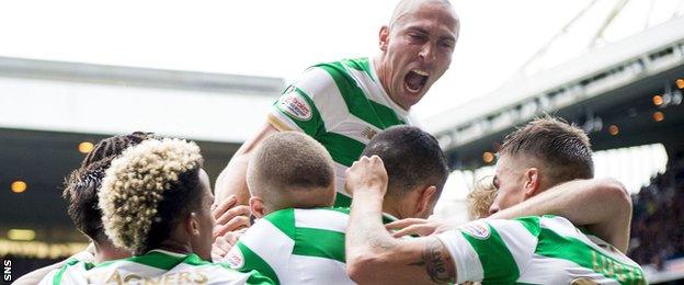 Celtic captain Scott Brown leads his side's celebrations at Ibrox