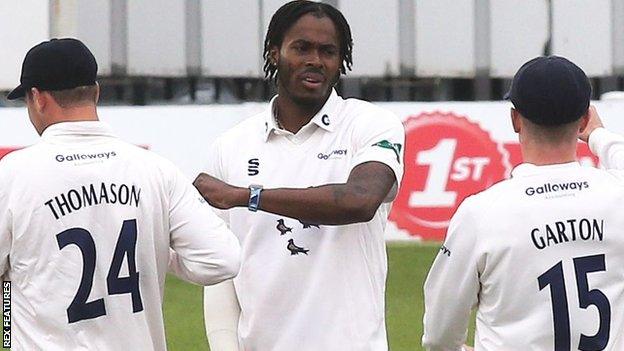 Jofra Archer celebrates taking the wicket of Kent opening batsman Jordan Cox