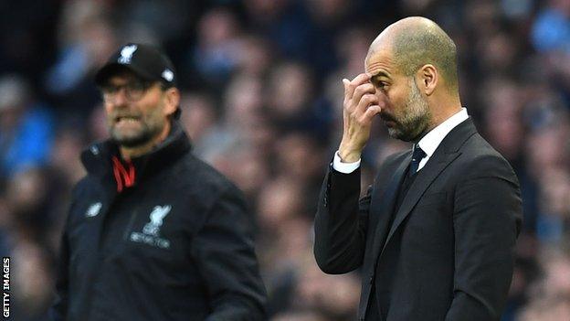 Jurgen Klopp and Pep Guardiola on the touchline during a Liverpool v Manchester City game