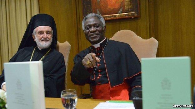 Orthodox metropolitan of Pergamon Joannis Zizioulas (left) and Cardinal Peter Kodwo Appiah Turkson smile during the official presentation of Pope Francis's encyclical during its official presentation, on 18 June 2015 at the Synod hall at the Vatican