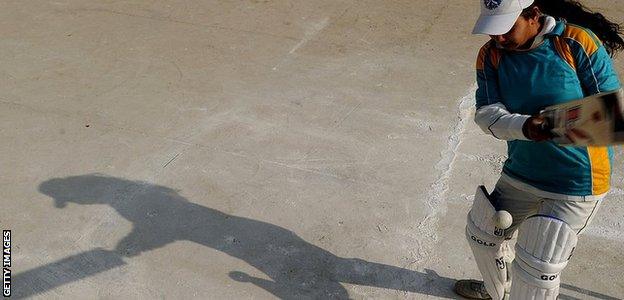 A girl plays cricket in Afghanistan