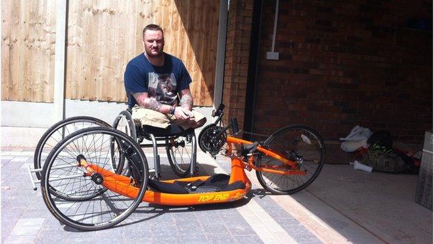 Clive with the hand bike he competed with in the Invictus Games at the Olympic velodrome last year