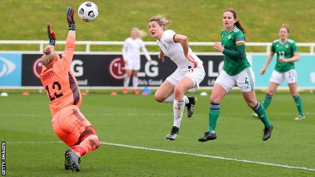 Ellen White scores past Becky Flaherty