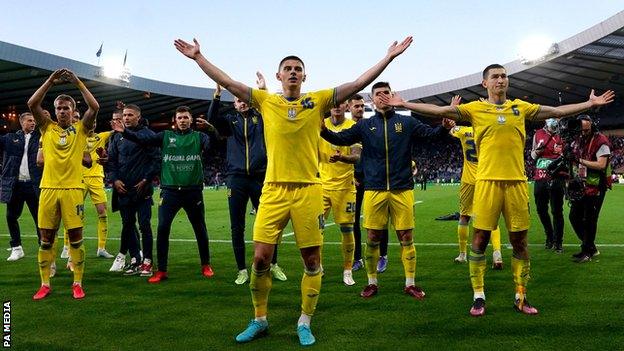 Ukraine players celebrate with their fans after an emotionally-charged World Cup play-off semi-final win in Scotland