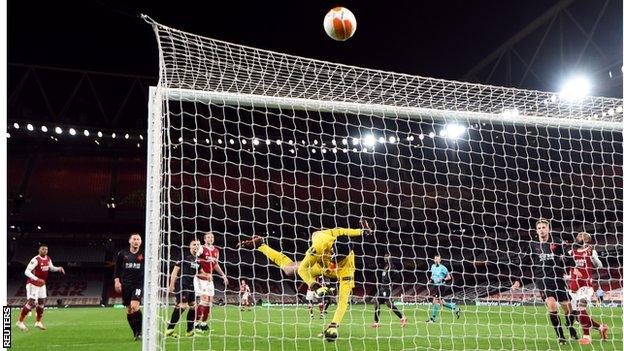 Slavia Prague keeper Ondrej Kolar produces a save against Arsenal in the Europa League