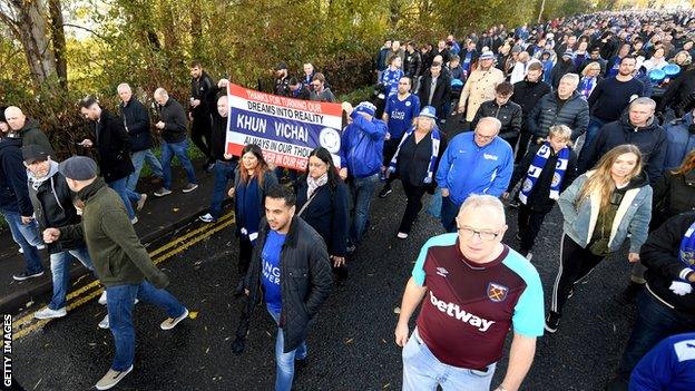 Fans march towards the King Power Stadium in honour of Vichai Srivaddhanaprabha