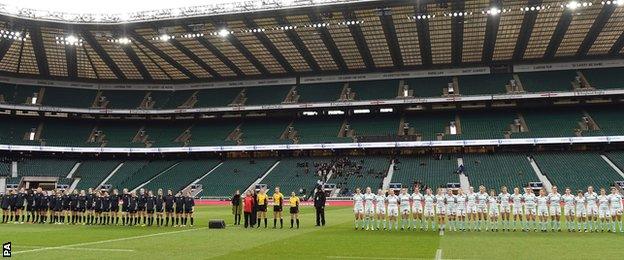 Women's Varsity match teams line-up for National Anthem