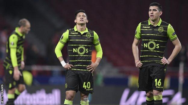 Sporting Lisbon players look dejected after defeat by Atletico Madrid