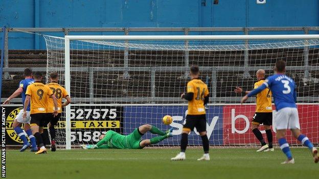 Jamie Devitt curls in Carlisle's second goal
