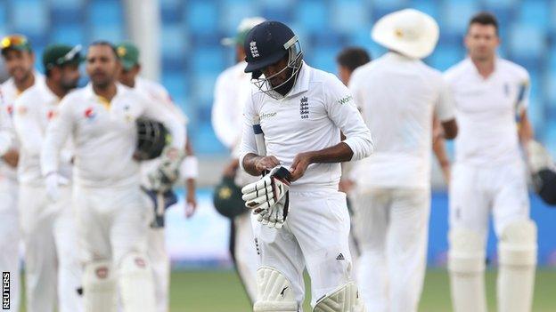 Adil Rashid walks off after his dismissal