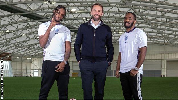 Krept and Konan flank Gareth Southgate.