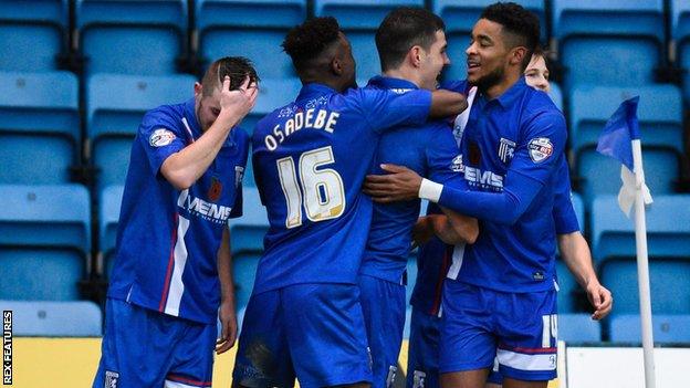 Gillingham's players celebrate John Egan's winner against Bury