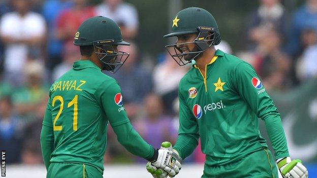 Mohammad Nawaz congratulates Shoaib Malik on his 50