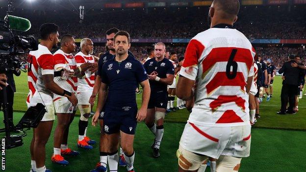 Scotland captain Greig Laidlaw leads his team off the field after losing to Japan