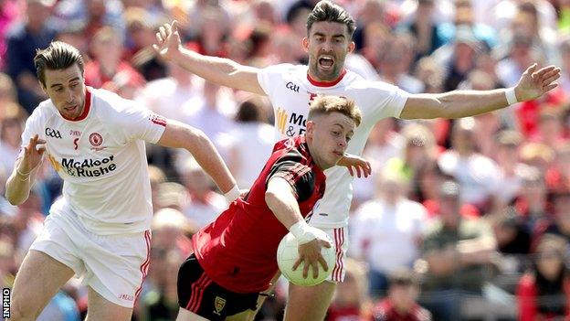 Down's Jerome Johnston in action against Conal McCann and Tiernan McCann in last year's Ulster Football final