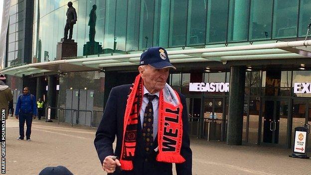 Harry Gregg at Old Trafford on Monday with the statue of Sir Matt Busby in the background