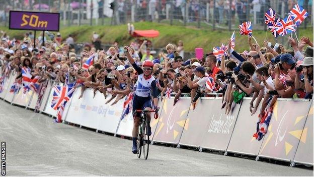 Sarah Storey celebrates winning the road race at London 2012